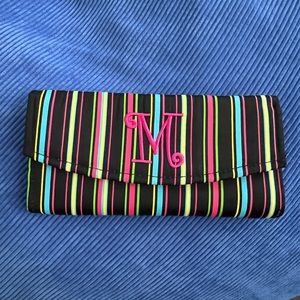 Colorful striped travel jewelry case with M monogram